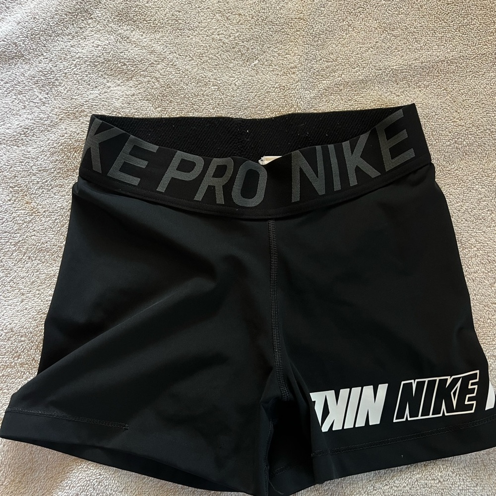 Nike pros with logo around leg size medium